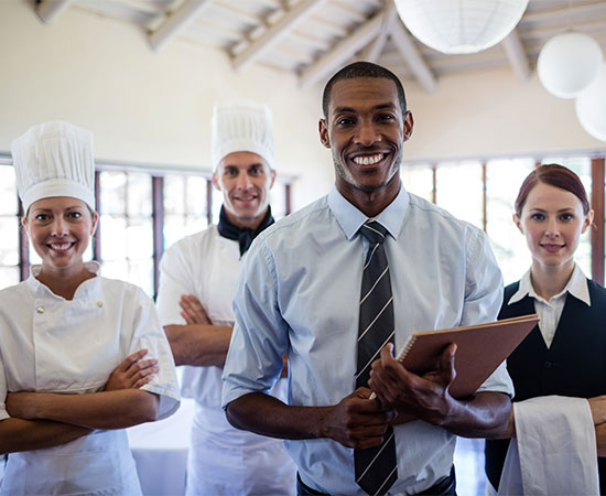 Group of hotel staffs standing in hotel