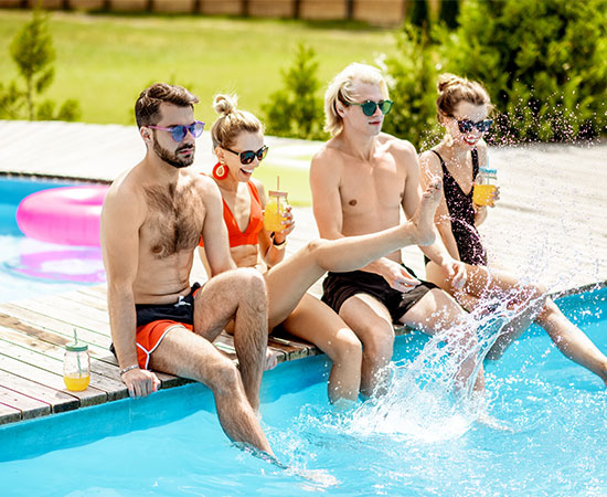 Friends on the swimming pool