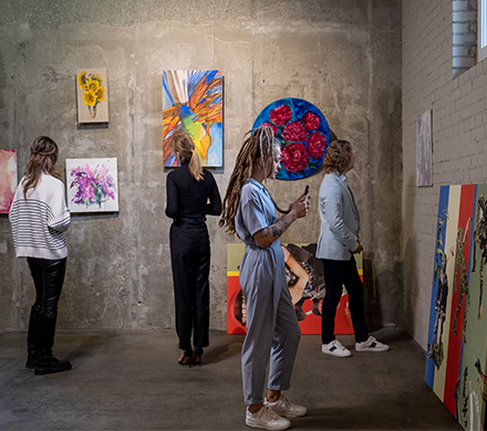 People visiting exhibition in art gallery